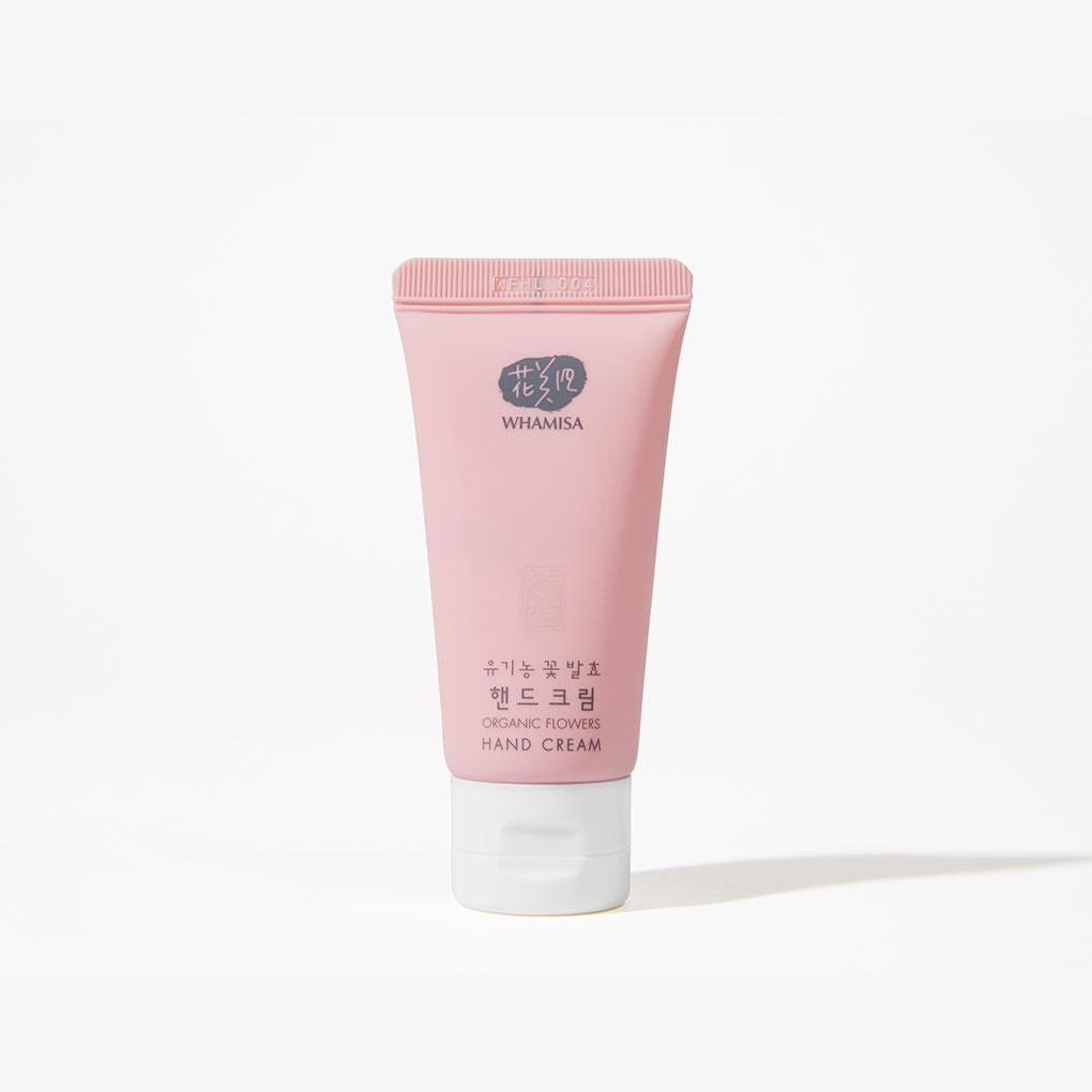 Whamisa Organic Flowers hand cream in a pink squeezable tube.