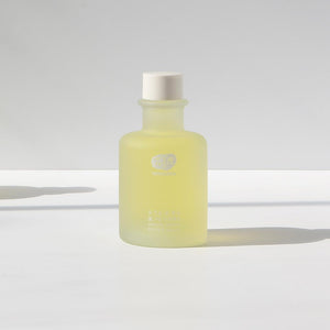 Whamisa Organic Flowers Toner Refresh. The bottle is cylindrical and the product has a deep yellow tint. The bottle has a cap on top for easy access.﻿